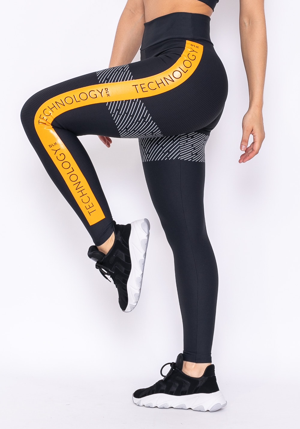 Calça legging technology preta com silk lateral amarelo ouro