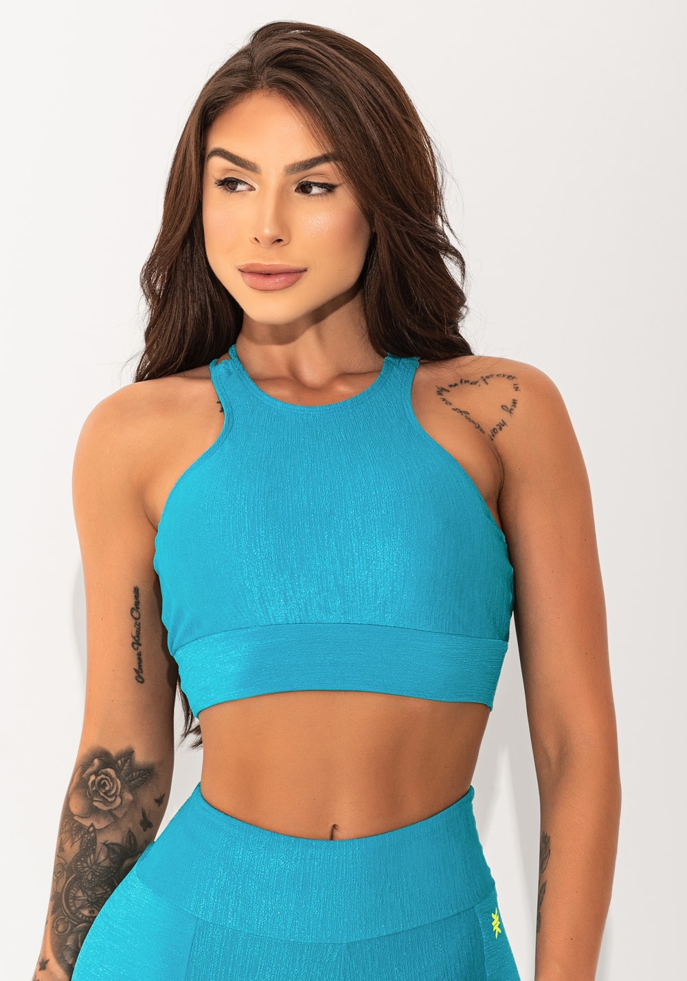 Top fitness feminino azul texturizado com alças cruzadas elegance