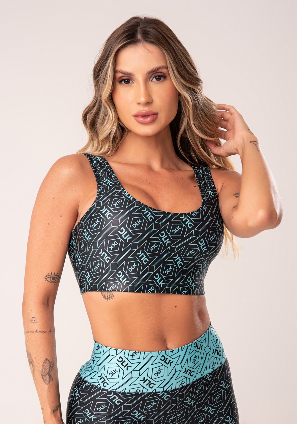 Top fitness feminino preto e verde logomania flow